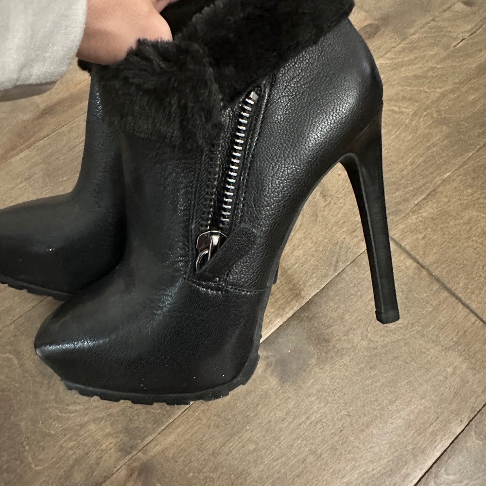Never Worn Black Guess booties with faux fur.